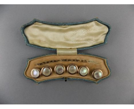 A Vintage Boxed Set of Six Gold Coloured and Mother of Pearl Studs. Unmarked, of Good Quality. 