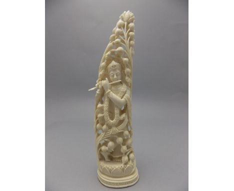 Oriental Early 20th Century - Finely Carved Ivory Figure of an Indian Deity Playing a Musical Instrument. Enclosed Behind a F