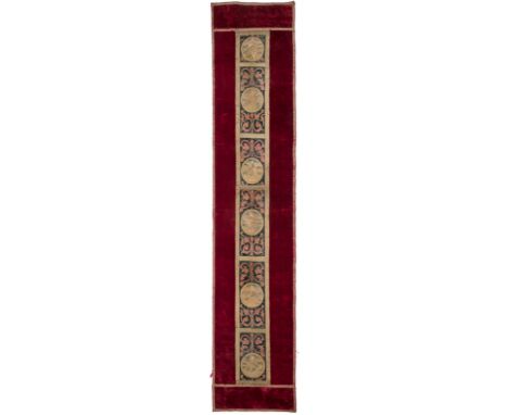 AN ANTIQUE VELVET AND BROCADE TAPESTRY WITH RELIGIOUS IMAGERYof deep red velvet with a central brocade panel featuring six ro