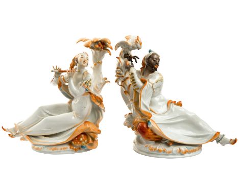 A PAIR OF PORCELAIN FIGURES OF A MOOR WITH PARROT AND LADY WITH FLUTE, MEISSEN, AFTER A MODEL BY PAUL SCHEURICHthe moor recli