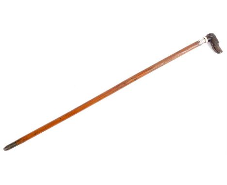 A LATE 19TH CENTURY CARVED DOGS HEAD WALKING STICK with glass eyes and bone collar above a silver foliate engraved collar hal