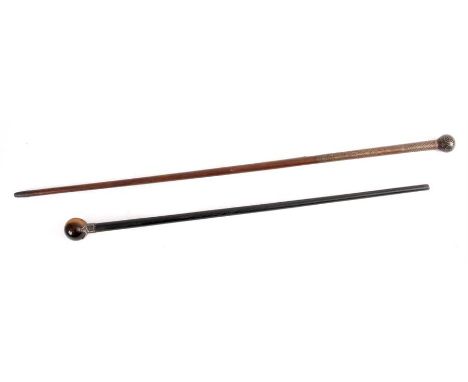 A 19TH CENTURY TIGER’S EYE HARDSTONE WALKING STICK with silver mounts on hardwood stick and a hardwood walking stick with int