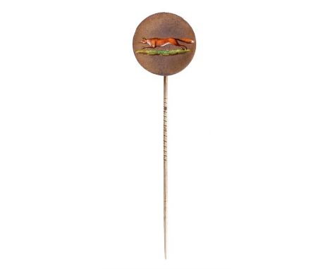 A GEORGE IV SILVER GILT AND ENAMEL CIRCULAR TIE PIN decorated with a running fox 9cm overall