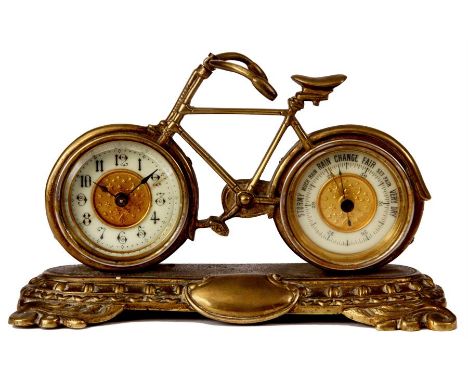 A LATE 19TH CENTURY BRITISH UNITED CO. BICYCLE CLOCK/BAROMETER. The front wheel containing a 5.5cm porcelain dial with Arabic