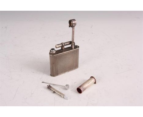 A 1930’s DUNHILL SILVERED METAL LADIES NOVELTY COMPACT IN THE FORM OF A LIGHTER the flattened engine turned body with hinged 