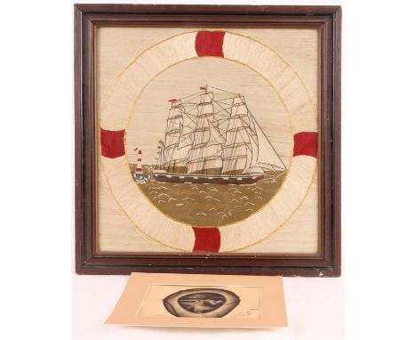 A LATE 19th CENTURY SAILORS TAPESTRY of a Tea Clipper on the sea, passing lighthouse surrounded by a lifebuoy 49cm high 49cm 
