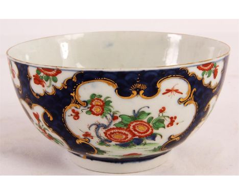 A GOOD FIRST PERIOD BLUE SCALE POLYCHROME WORCESTER BOWL with finely painted scrolled gilt-edged floral and landscape panels 