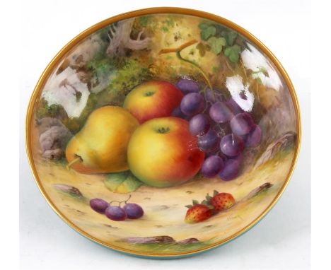 ALBERT SHUCK A ROYAL WORCESTER SHALLOW FOOTED BOWL the ogee moulded body with green exterior and gilded rim enclosing a finel