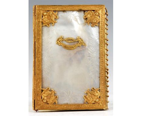 AN EARLY 19TH CENTURY FRENCH MOTHER OF PEARL AND ORMOLU SOUVENIR NOTE PAD from the hotel CHEATUE LE FUEL having the original 