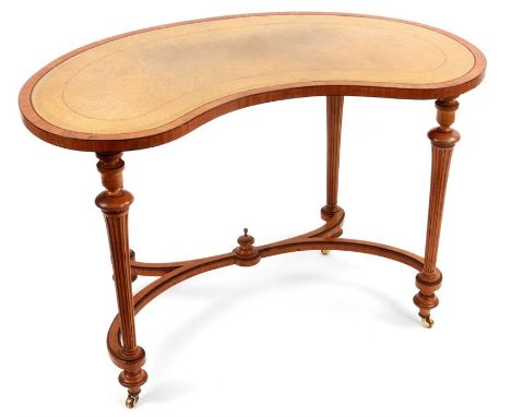 A MID 19TH CENTURY EBONY LINED SATINWOOD KIDNEY SHAPED WRITING TABLE with tooled leather top and shallow frieze, standing on 