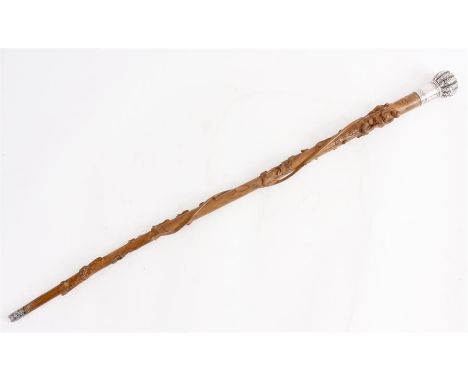 A LATE 19TH CENTURY CHINESE SILVER MOUNTED WALKING STICK with large foliate embossed ribbed bulbous handle with birds, animal