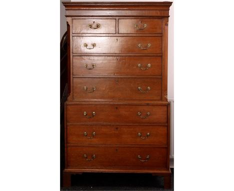 A GEORGE III HONEY COLOURED OAK CHEST ON CHEST with mahogany inlaid moulded cornice above two small and six graduated drawers