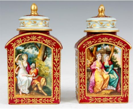 A PAIR OF LATE 19TH CENTURY VIENNA RECTANGULAR ARCH-TOP TEA CADDIES AND COVERS crimson ground with pale blue and gilded side 