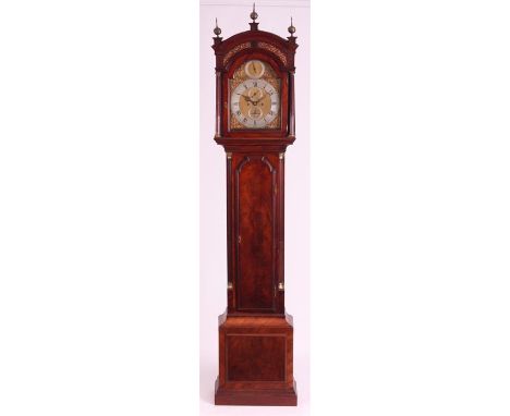 THOMAS DREW, LONDONA GEORGE III FIGURED MAHOGANY EIGHT DAY LONGCASE CLOCK surmounted by three brass finials above a break arc