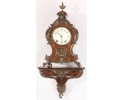 A LATE 19TH CENTURY FRENCH ROCOCO WALNUT BRACKET CLOCK AND STAND with ornate scrolled leaf cast mask head mounts, with an Ivo