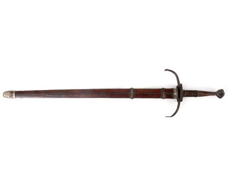 A LARGE EASTERN SWORD with leather handle, curved hand guard with moon crescent face decoration, large steel double edged bla