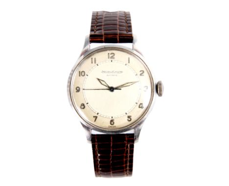A GENTLEMAN’S VINTAGE STAINLESS STEEL JAEGER LECOULTRE WRISTWATCH on leather strap with champagne dial having matt chapter ri