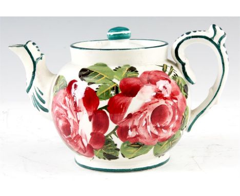 A LATE 19TH CENTURY SMALL WEMYSS TEAPOT of bullet-shape, painted in the pink roses pattern 10cm high 16cm across - impressed 