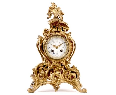 MID 19TH CENTURY FRENCH GILT BRASS MANTEL CLOCK the rococo style case embossed with acanthus leaves and scrolls enclosing a 3