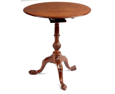 A GEORGE III FIGURED MAHOGANY BIRDCAGE TILT TOP TRIPOD TABLE the round moulded edge top above a revolving birdcage and turned