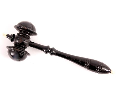 A LATE 19TH EBONISED WOODEN TURNED GAVEL with ivory finials 29cm long