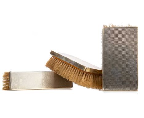 GEORGE VI SILVER BRUSH SET,maker Barker Brothers, Birmingham 1938, comprising two clothes brushes and a shoe brush, each with