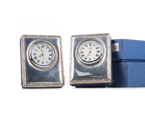 THREE SMALL ELIZABETH II SILVER MOUNTED CLOCKS,maker Carr's, Sheffield, 7cm high, together with a small silver plate mounted 