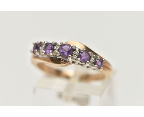 A 9CT GOLD AMETHYST AND DIAMOND RING, designed with a row of graduating circular cut amethyst, interspaced with single cut di