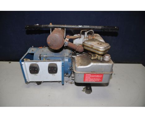 A PETROL GENERATOR with a 5hp Briggs and Stratton engine and two plug sockets (UNTESTED but engine pulling freely)