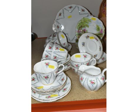 A ROYAL ALBERT 'MINUET' PATTERN TEA SET, comprising sugar bowl and milk jug, cake plate, six cups (one broken and glued, one 