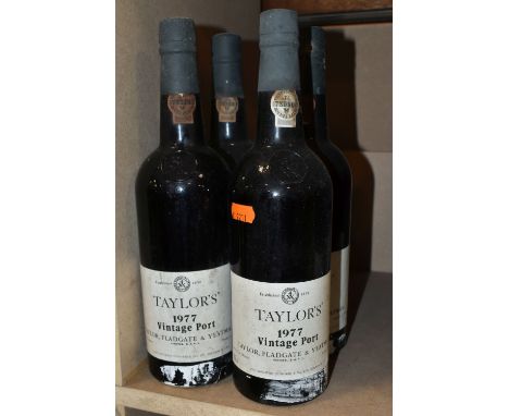 FOUR BOTTLES OF  TAYLOR'S 1977 VINTAGE PORT, bottled in Oporto by Taylor, Fladgate &amp; Yeatman, 21% vol. 75cl, all seals ap