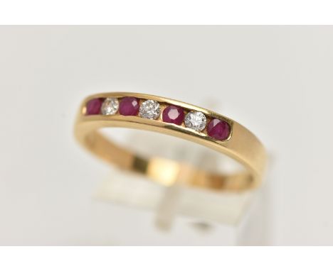 AN 18CT GOLD DIAMOND AND RUBY BAND RING, three round brilliant cut diamonds interspaced with four circular cut rubies, channe