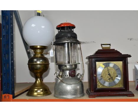 TWO OIL LAMPS AND A FRANZ HERMLE MANTLE CLOCK, made in West Germany, two jewells with key, missing back cover, a Swedish 'Opt