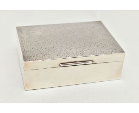 AN ELIZABETH II SILVER RECTANGULAR CIGARETTE BOX, textured finish to the hinged cover, cedar wood lined interior, maker K L D