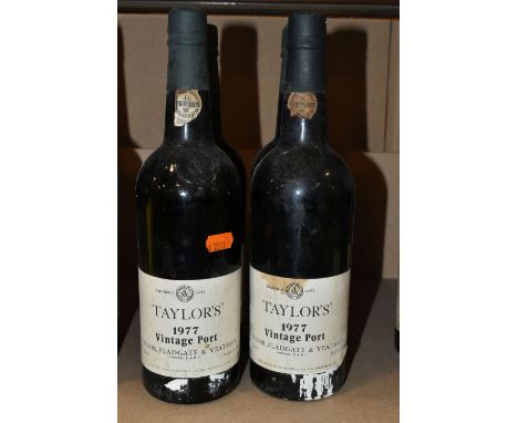 FOUR BOTTLES OF  TAYLOR'S 1977 VINTAGE PORT, bottled in Oporto by Taylor, Fladgate &amp; Yeatman, 21% vol. 75cl, all seals ap