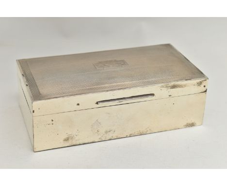 A GEORGE V SILVER RECTANGULAR CIGARETTE BOX, engine turned hinged cover with vacant cartouche, two division cedarwood lined i