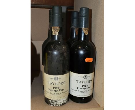 FOUR BOTTLES OF TAYLOR'S 1977 VINTAGE PORT, bottled in Oporto by Taylor, Fladgate &amp; Yeatman, 21% vol. 75cl, all seals app