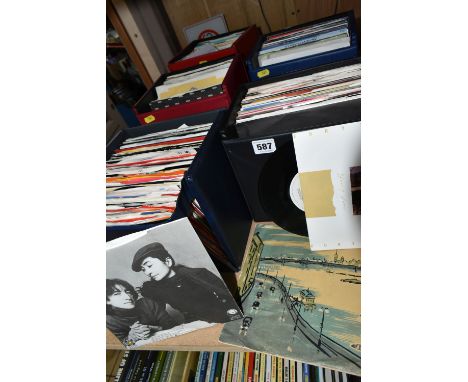 FIVE SINGLES RECORD CASES CONTAINING APPROXIMATELY TWO HUNDRED AND NINETY SINGLES, artists include The Stranglers, ELP, Wings