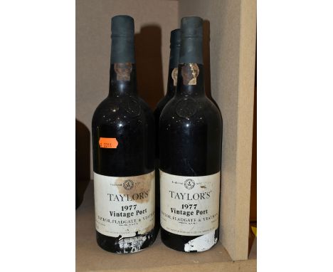 FOUR BOTTLES OF  TAYLOR'S 1977 VINTAGE PORT, bottled in Oporto by Taylor, Fladgate &amp; Yeatman, 21% vol. 75cl, all seals ap