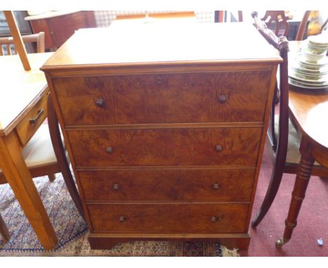 A 19th Century burr walnut secretaire chest with pull out desk above three drawers and raised on carved bracket feet. H-97cm,