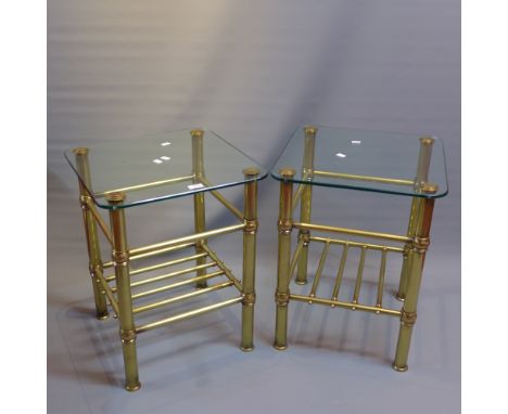 A pair of campaign style brass lamp tables with glass tops. 