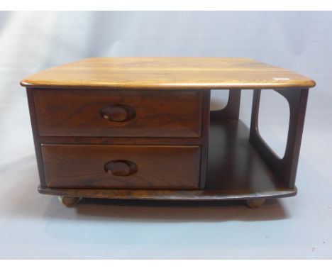 A vintage Ercol side coffee table having two drawers beneath