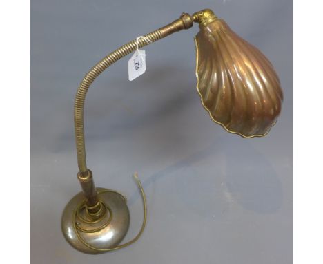 An Art Deco 1920s gold colour desk lamp having shell style shade