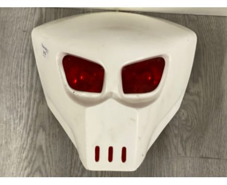 Motorbike front light in the style of a Predator mask