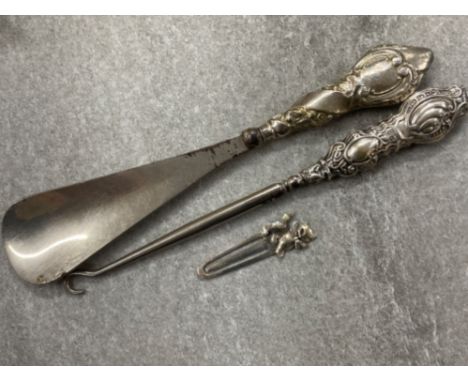 Antique silver handled (Henry Williamson) hallmarked Chester 1909 shoe horn together with a hallmarked Birmingham 1912 silver