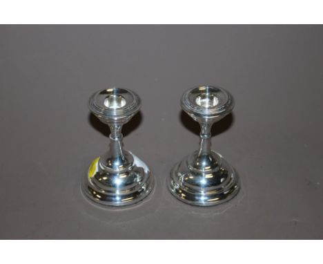 A PAIR OF BIRMINGHAM HALLMARKED SILVER DWARF CANDLESTICK HOLDERS