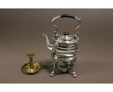 A SILVER PLATED SPIRIT KETTLE ON STAND WITH BURNER + BRASS CANDLESTICK HOLDER