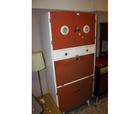 A RETRO VINTAGE KITCHEN CUPBOARD WITH DROP DOWN ENAMEL FRONT