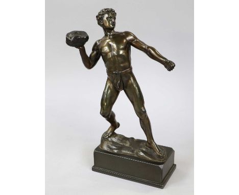 After Hermann Eichberg, a patinated spelter figure of a Grecian athlete hurling a boulder, signed, 34cm high
