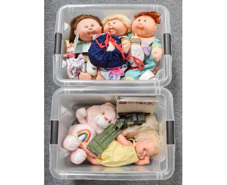 Two Boxes of Toys Including Cabbage patch kids doll Iona Pauline, Colbert Nelson and others with accessories, a care bear "Ch